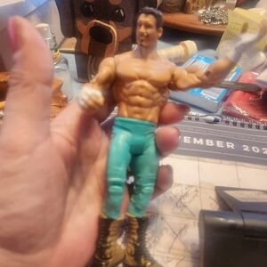 Action Figure with Teal Pants and Brown Boots Eddie Guerroro